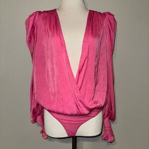 Silk fuchsia ruffle sleeve bodysuit.